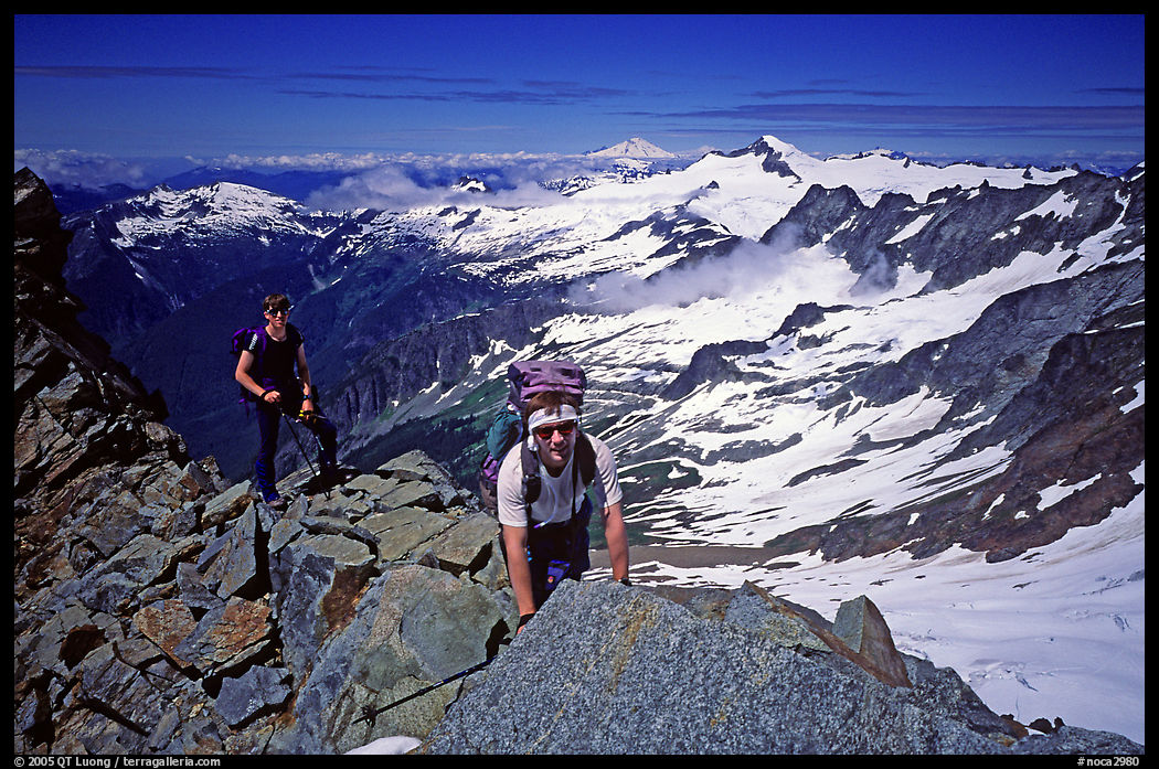 Mountaineers on ridge just below  summit of Sahale Peak. North Cascades National Park, Washington, USA.