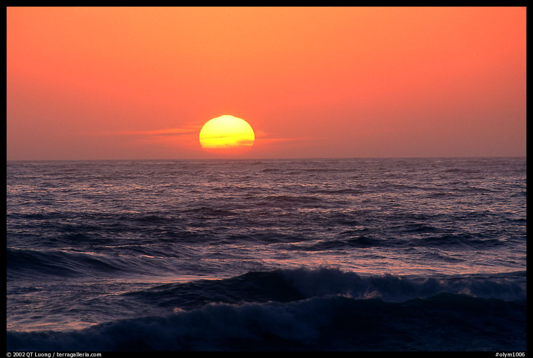 Disc of sun setting in  pacific, Shi-shi beach. Olympic National Park, Washington, USA.