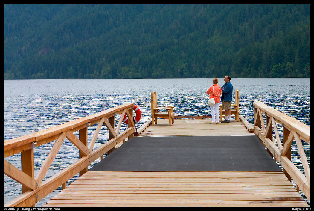 Couple on Pier, Crescent Lake. Olympic National Park, Washington, USA.