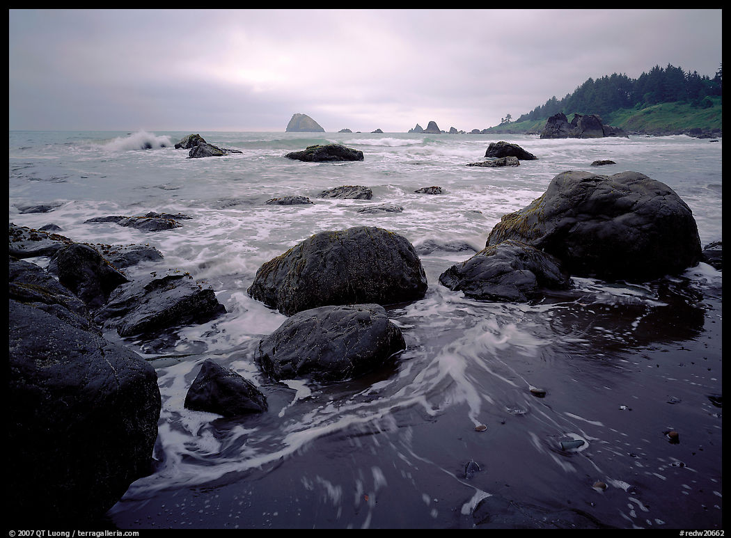 Sand, boulders and surf, Hidden Beach. Redwood National Park, California, USA.