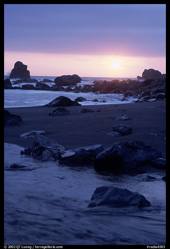 Stream on beach at sunset, False Klamath cove. Redwood National Park, California, USA.