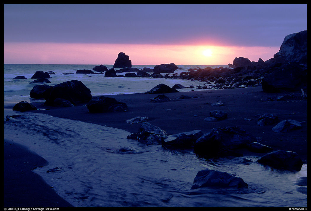 Stream reaches Pacific, False Klamath cove, sunset. Redwood National Park, California, USA.