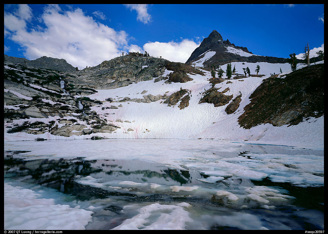 Monarch lake half-frozen in early summer. Sequoia National Park, California, USA.