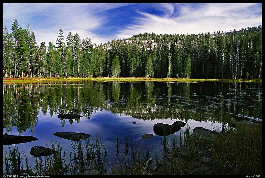 Boulders and reflexions, Siesta Lake, afternoon. Yosemite National Park, California, USA.