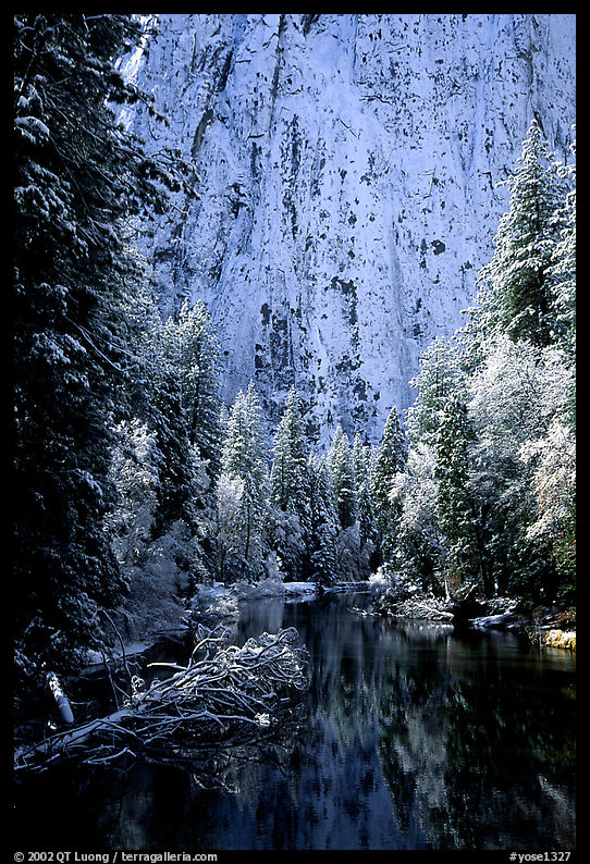 Cathedral rocks with fresh snow reflected in Merced River, early morning. Yosemite National Park