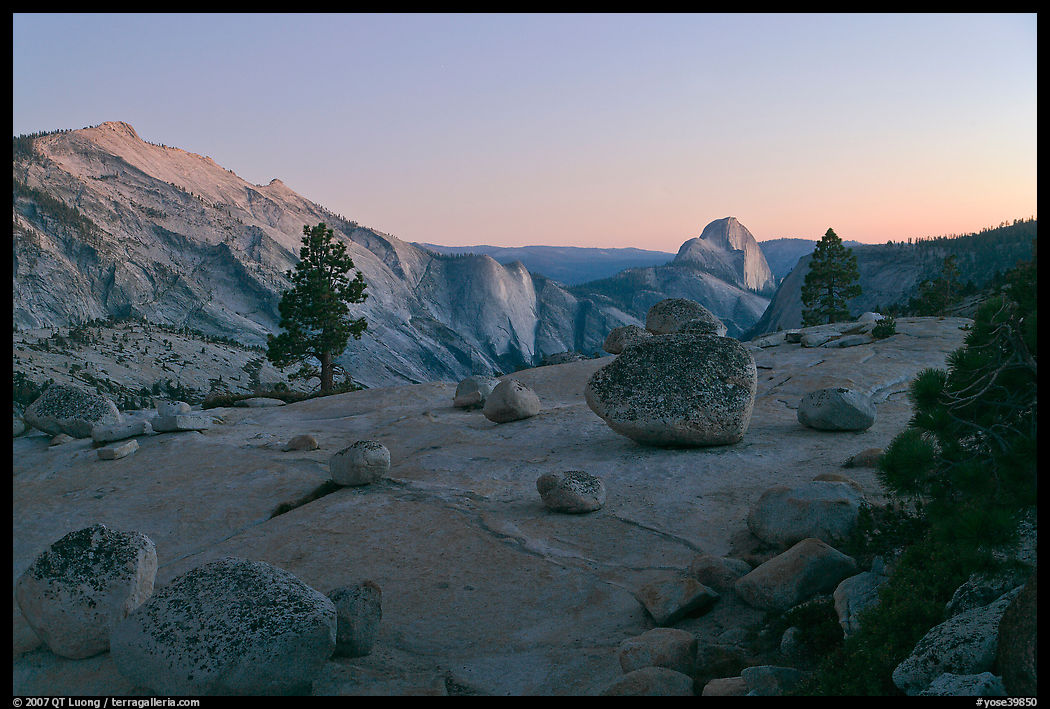 Glacial erratic boulders, Clouds Rest, and Half-Dome from Olmstedt Point, dusk. Yosemite National Park, California, USA.