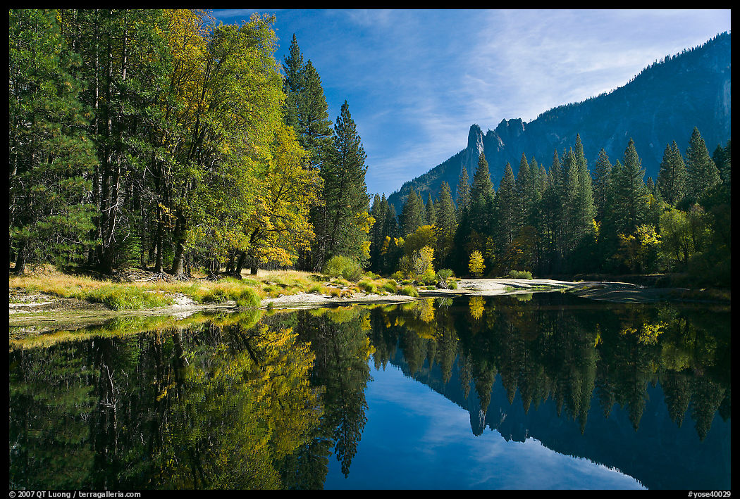 Merced River with fall colors and Sentinel Rocks reflexions. Yosemite National Park, California, USA.