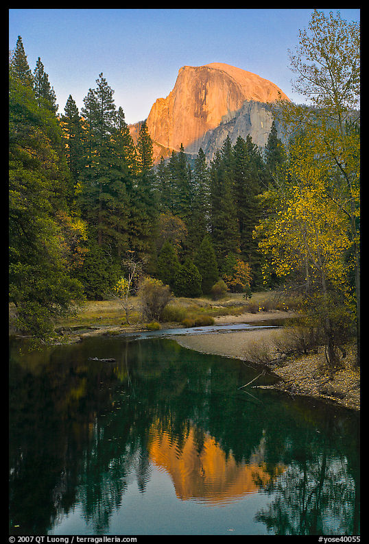 Half Dome reflected in Merced River at sunset. Yosemite National Park, California, USA.