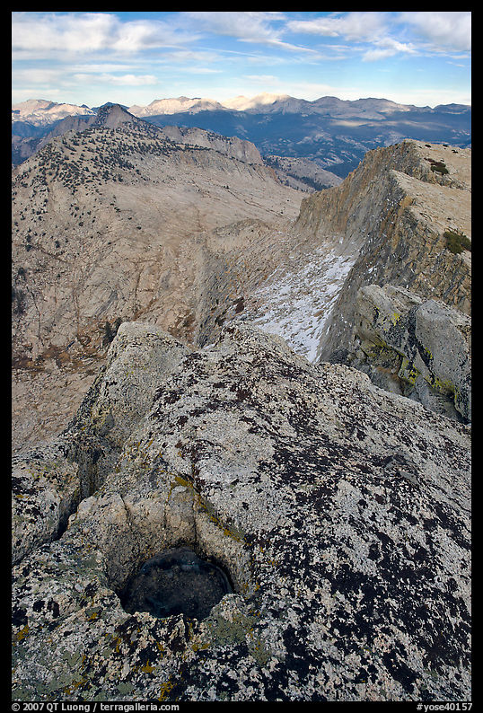 Frozen pot hole and summit cliffs, Mount Hoffman. Yosemite National Park, California, USA.
