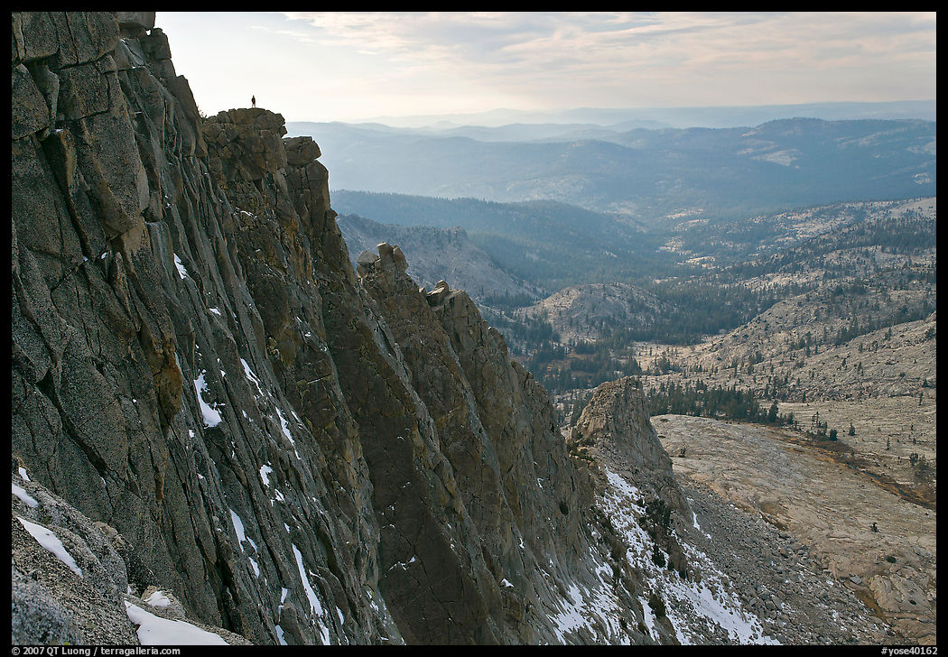 Cliffs on  North Face of Mount Hoffman with hiker standing on top. Yosemite National Park, California, USA.