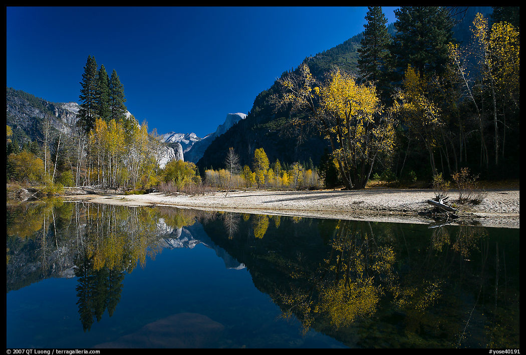 Banks of  Merced River with Half-Dome reflexions in autumn. Yosemite National Park, California, USA.