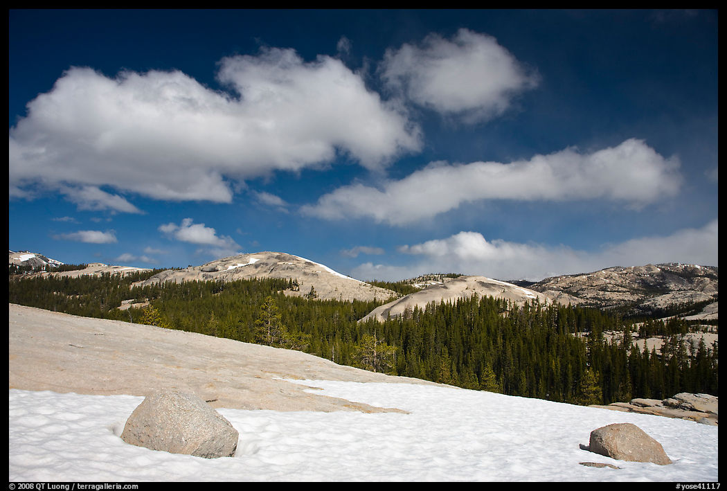 Snow on slab, boulders, and distant domes, Tuolumne Meadows. Yosemite National Park