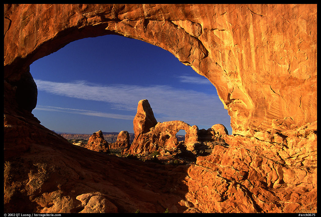 Turret Arch seen through South Window, sunrise. Arches National Park, Utah, USA.