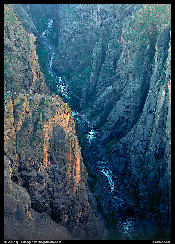 View down steep rock walls and narrow chasm. Black Canyon of the Gunnison National Park, Colorado, USA.