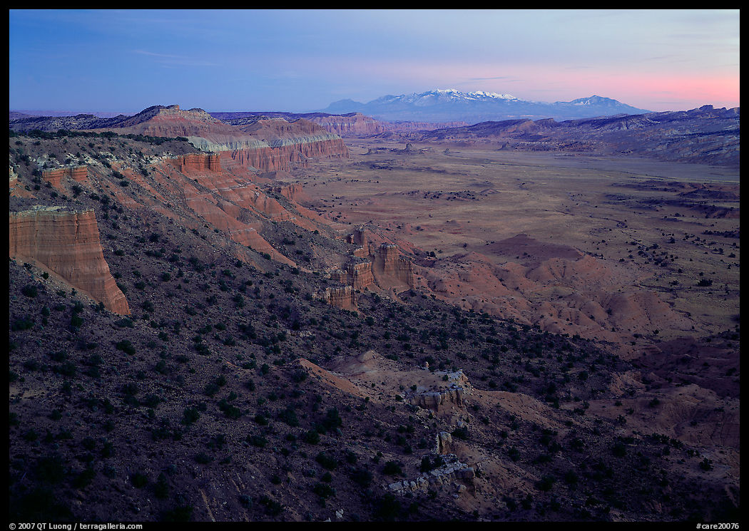 Waterpocket fold and snowy mountains at dusk. Capitol Reef National Park