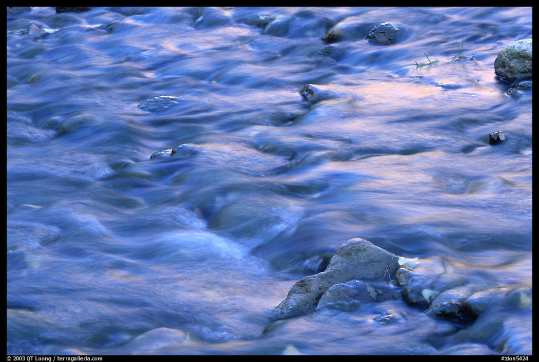 Water flowing in the Virgin River, with reflections from cliffs. Zion National Park