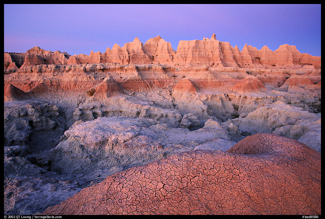 Cracked mud and erosion formations, Cedar Pass, dawn. Badlands National Park, South Dakota, USA.