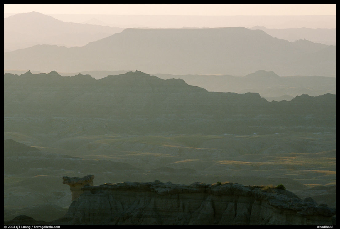 Backlit ridges of the Stronghold table in the southern unit, sunrise. Badlands National Park, South Dakota, USA.