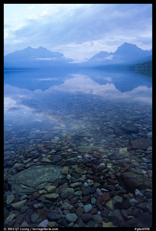 Peebles in lake McDonald and mountains. Glacier National Park