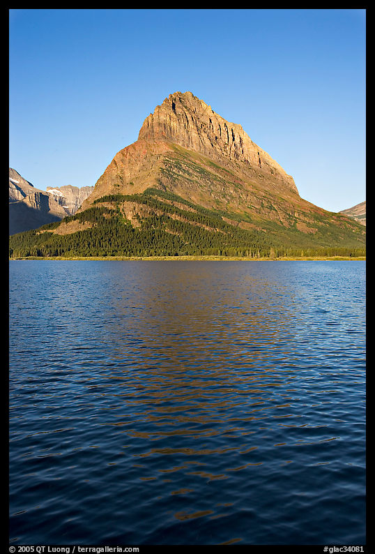 Grinnell Point across Swiftcurrent Lake, sunrise. Glacier National Park