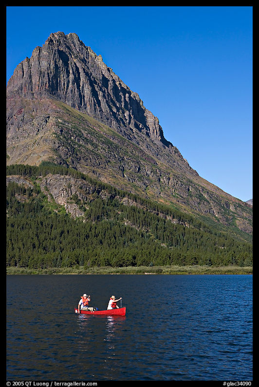 Red canoe on Swiftcurrent Lake. Glacier National Park, Montana, USA.