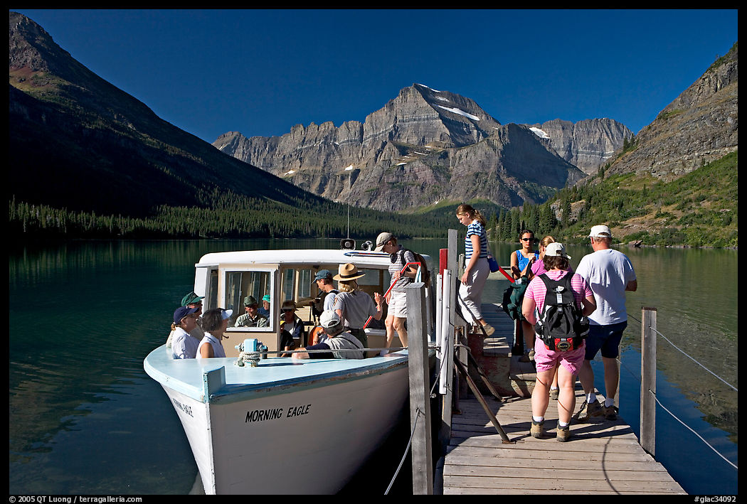 Passengers embarking on tour boat at the end of Lake Josephine. Glacier National Park, Montana, USA.