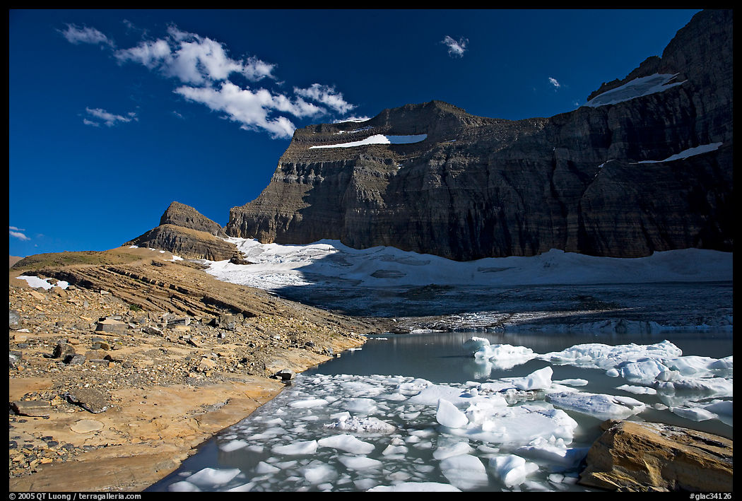 Upper Grinnell Lake with icebergs, late afternoon. Glacier National Park, Montana, USA.