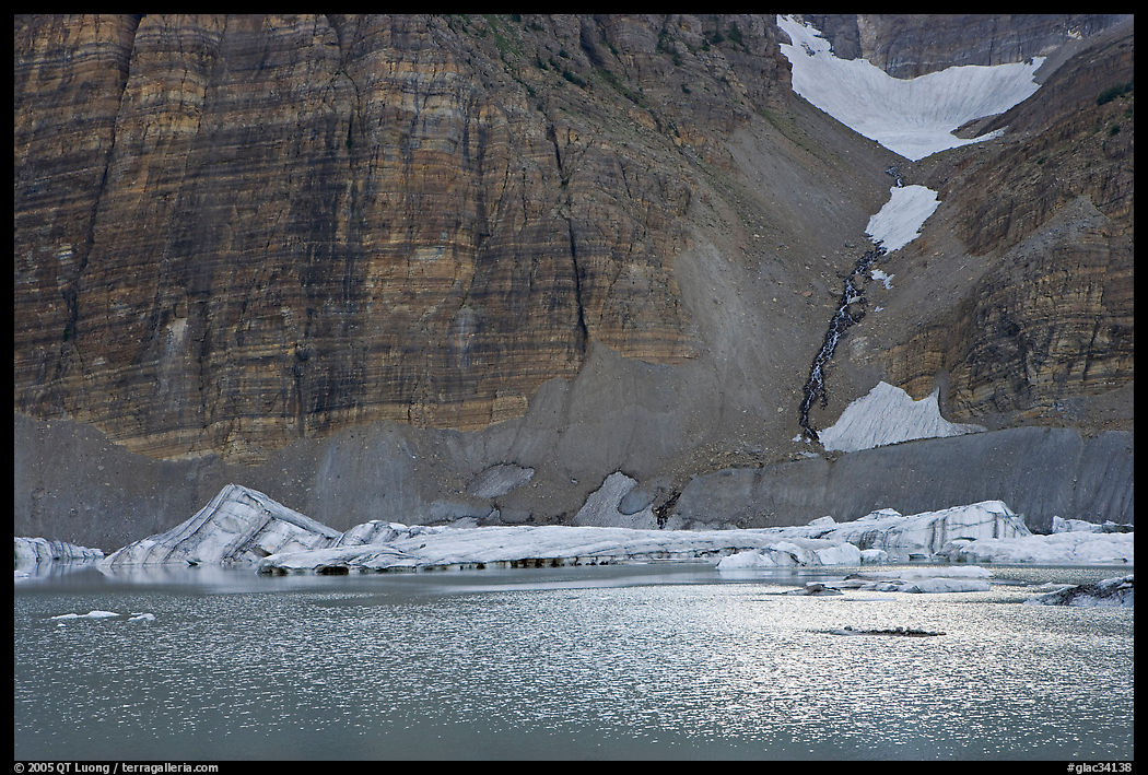 Ripples on Upper Grinnel Lake, with icebergs and glacier. Glacier National Park, Montana, USA.