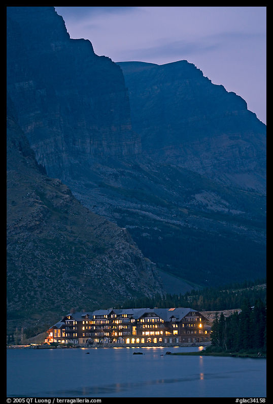 Many Glacier lodge and Swiftcurrent Lake at dusk. Glacier National Park, Montana, USA.