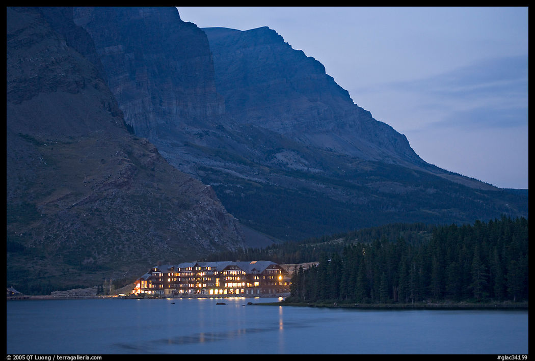 Swiftcurrent Lake and Many Glacier Lodge lights at dusk. Glacier National Park, Montana, USA.