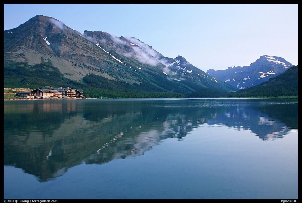 Many Glacier Hotel reflected in Swiftcurrent Lake. Glacier National Park, Montana, USA.
