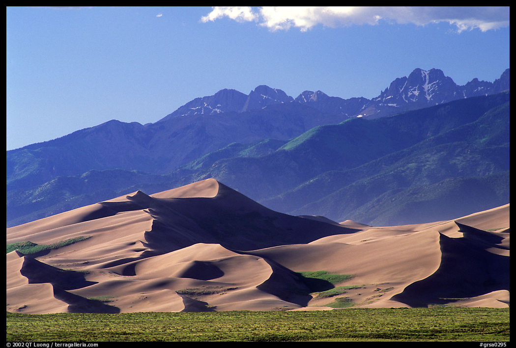 Distant view of Dunes and Sangre de Christo mountains in late afternoon. Great Sand Dunes National Park, Colorado, USA.