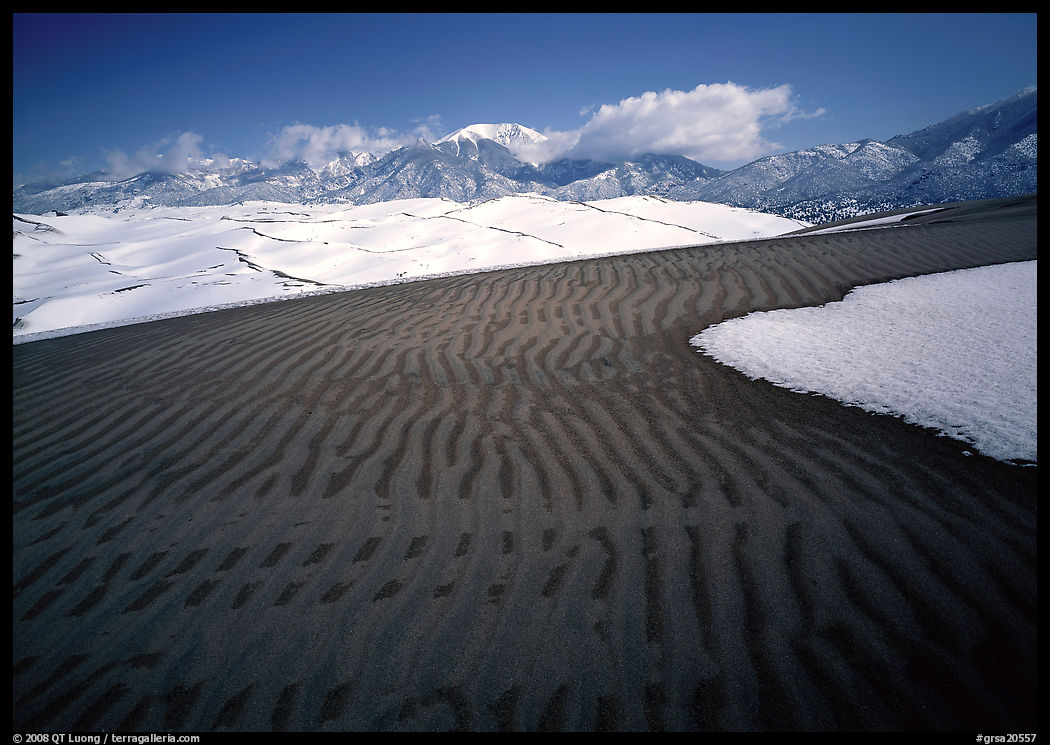 Ripples in partly snow-covered sand dunes. Great Sand Dunes National Park, Colorado, USA.