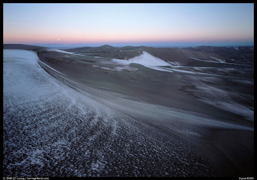 Sparse snow on the dunes at dawn. Great Sand Dunes National Park, Colorado, USA.