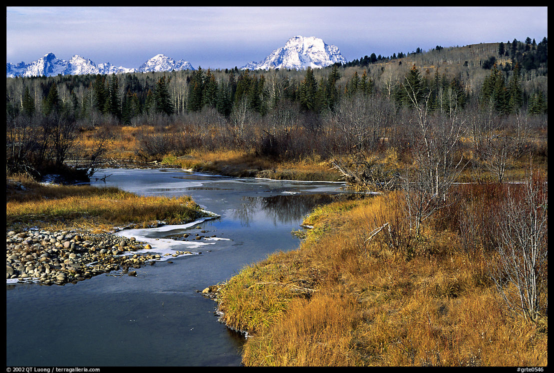 Stream, with Mt Moran emerging from ridige, late fall. Grand Teton National Park, Wyoming, USA.