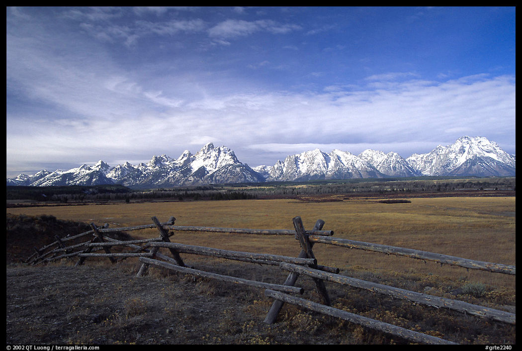 Fence, meadow, and Teton Range. Grand Teton National Park, Wyoming, USA.