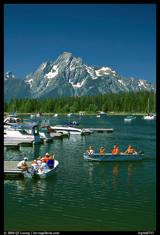 Boaters at Colter Bay marina with Mt Moran in the background, morning. Grand Teton National Park