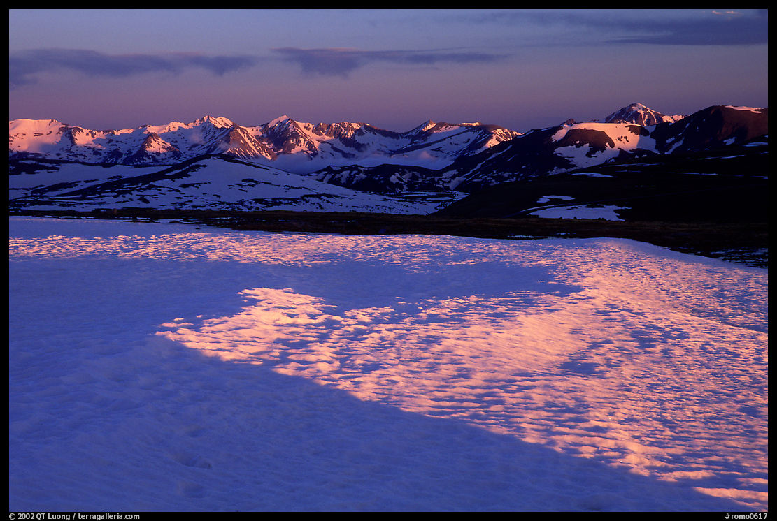 Neve near Rock Cut and Never Summer range in early summer at sunset. Rocky Mountain National Park, Colorado, USA.