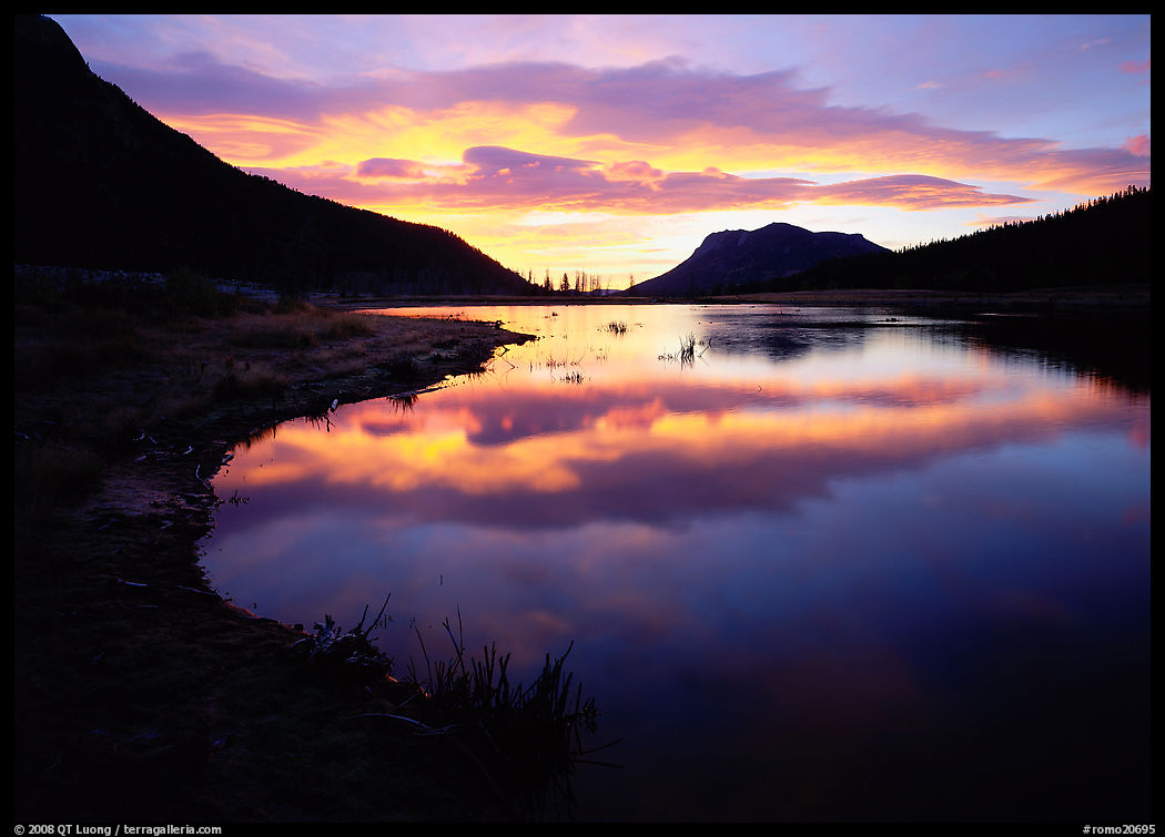 Pond with cloud reflexion at sunrise, Horsehoe Park. Rocky Mountain National Park, Colorado, USA.
