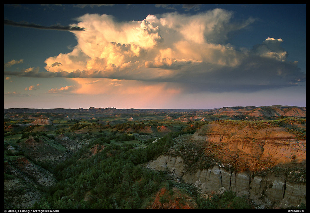 Storm cloud and badlands at sunset, outh Unit. Theodore Roosevelt  National Park, North Dakota, USA.