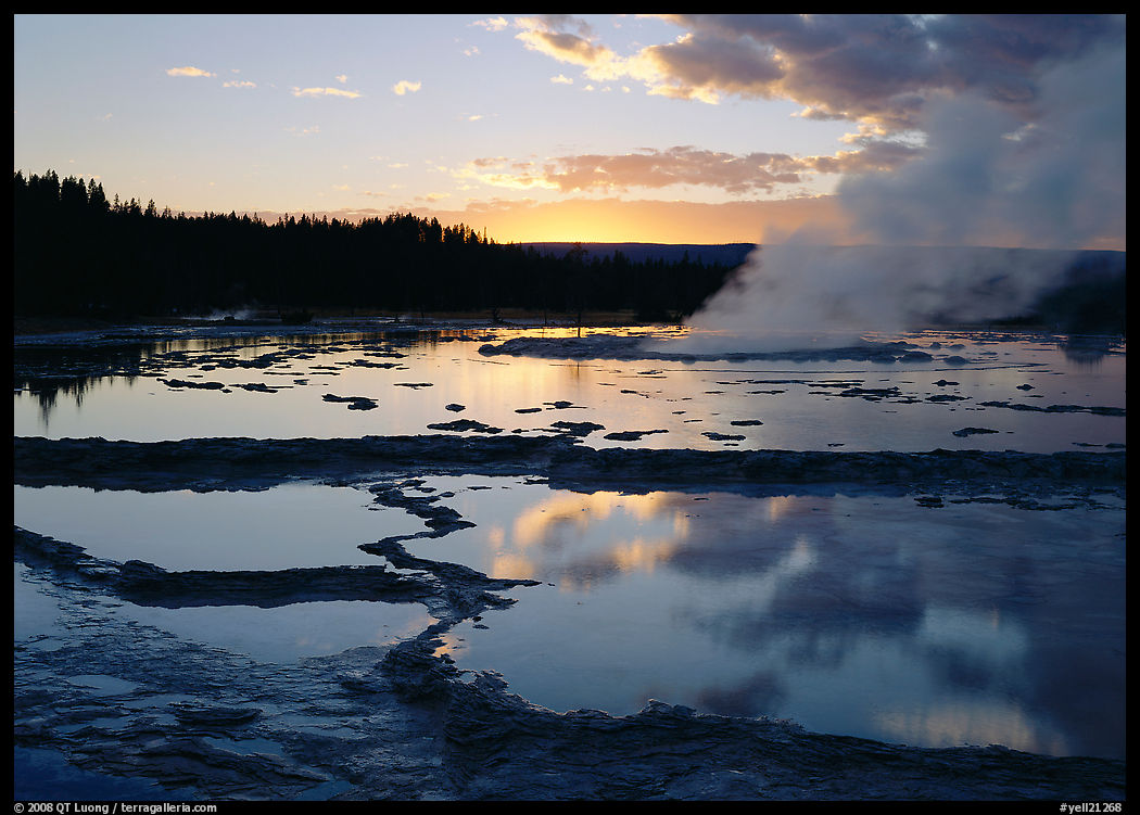Great Fountain Geyser with residual steam at sunset. Yellowstone National Park, Wyoming, USA.