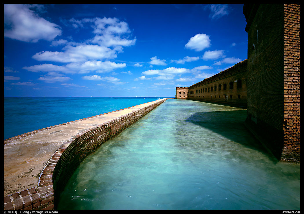 Moat with turquoise waters, seawall, and fort. Dry Tortugas  National Park, Florida, USA.