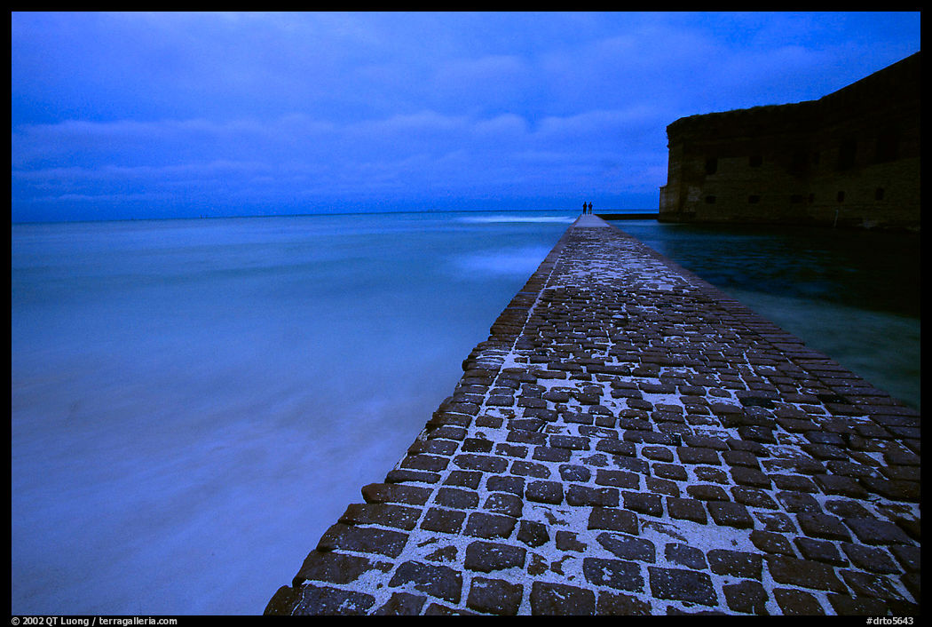 Brick seawall at dusk during a storm. Dry Tortugas  National Park, Florida, USA.