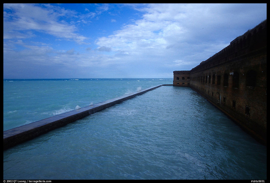 Seascape with fort seawall and moat on cloudy day. Dry Tortugas  National Park, Florida, USA.