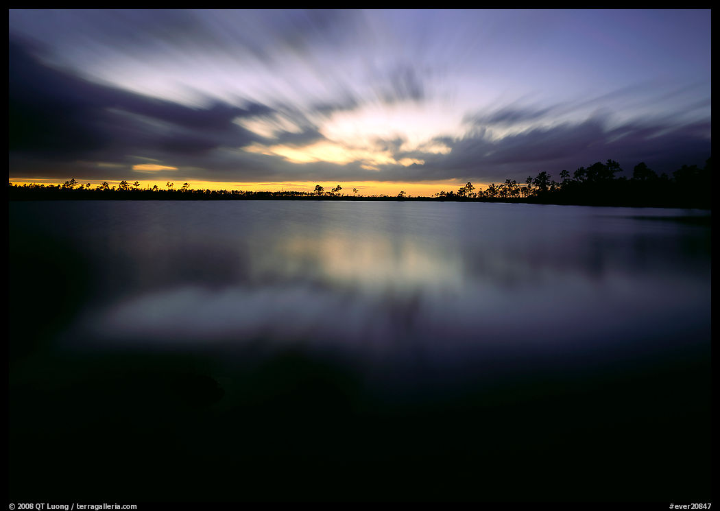 Dusk at Pine Glades Lake, with blured water and clouds. Everglades  National Park, Florida, USA.