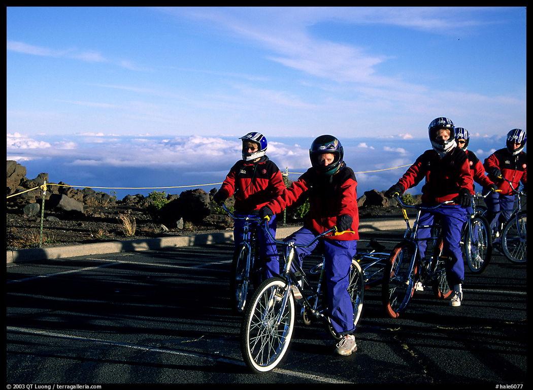 Getting ready to ride bicycles down from the top of the Crater to sea level. Haleakala National Park, Hawaii, USA.