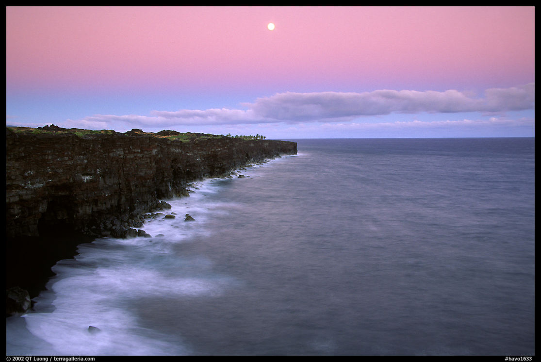 Holei Pali cliffs and moon at dusk. Hawaii Volcanoes National Park, Hawaii, USA.