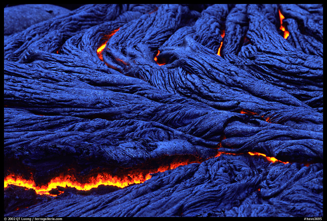 Close-up of ripples of flowing pahoehoe lava at dusk. Hawaii Volcanoes National Park