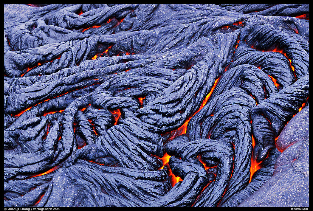 Braids of pahoehoe lava with red hot lava showing through cracks. Hawaii Volcanoes National Park, Hawaii, USA.