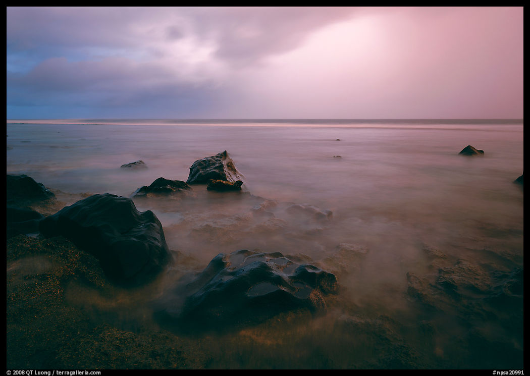 Rocks in water and approaching storm, Siu Point, Tau Island. National Park of American Samoa